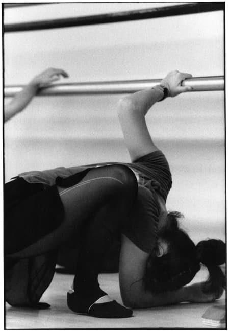 Black and white dancer photograph titled Stretching Curves by Angelique Antoniou